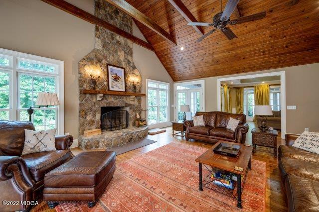 7959 Whittle Road Macon, GA 31220 - Photo 32 of 49 a living room with furniture a fireplace and a table