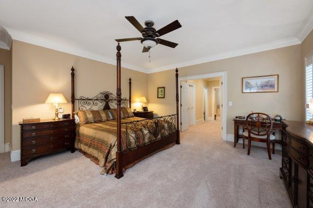 7959 Whittle Road Macon, GA 31220 - Photo 33 of 49 a bedroom with a bed chandelier and a window