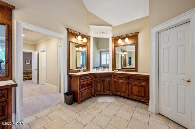 7959 Whittle Road Macon, GA 31220 - Photo 34 of 49 a large bathroom with a large mirror vanity and double