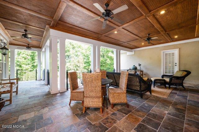 7959 Whittle Road Macon, GA 31220 - Photo 4 of 49 a living room with patio furniture and a large window