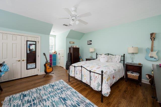 7959 Whittle Road Macon, GA 31220 - Photo 47 of 49 a spacious bedroom with a bed and a chandelier