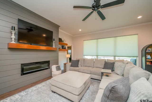 a living room with furniture and a flat screen tv