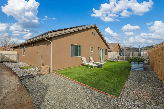 a view of a back yard of the house