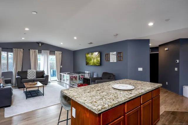 a kitchen with a table and chairs in it