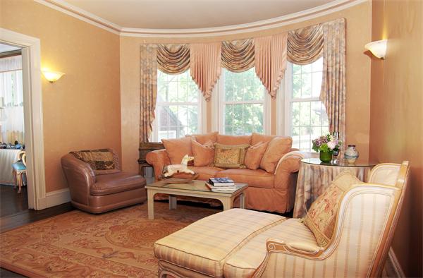 199 Dean Road Brookline, MA 02445 - Photo 3 of 15 a living room with furniture and a large window