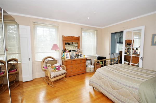 199 Dean Road Brookline, MA 02445 - Photo 7 of 15 a bedroom with a bed and a window