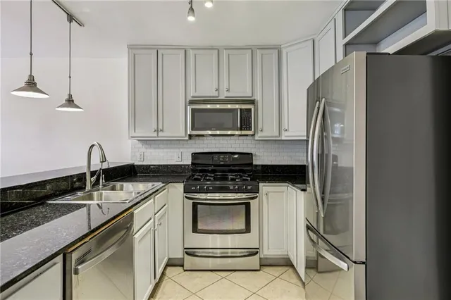 a kitchen with a stove microwave and refrigerator