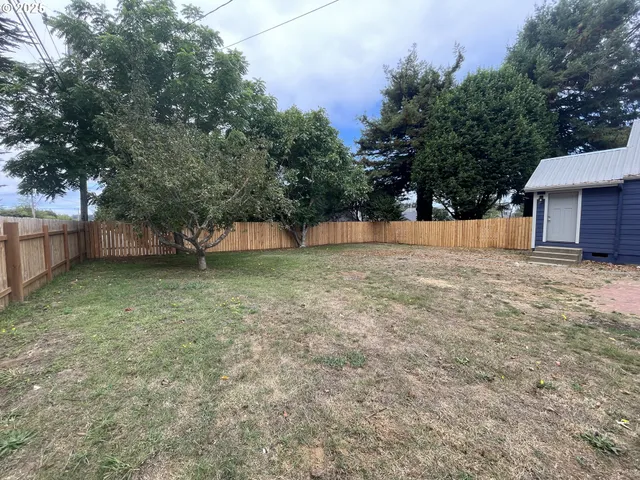 a backyard of a house with lots of green space