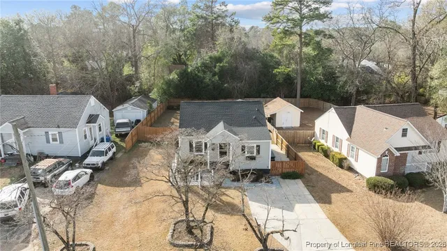 an aerial view of multiple houses with yard