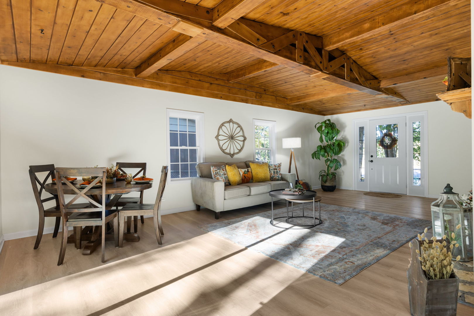 275 Indian Trail Lake In The Hills, IL 60156 - Photo 11 of 25 a living room with furniture a clock on wall and a potted plant