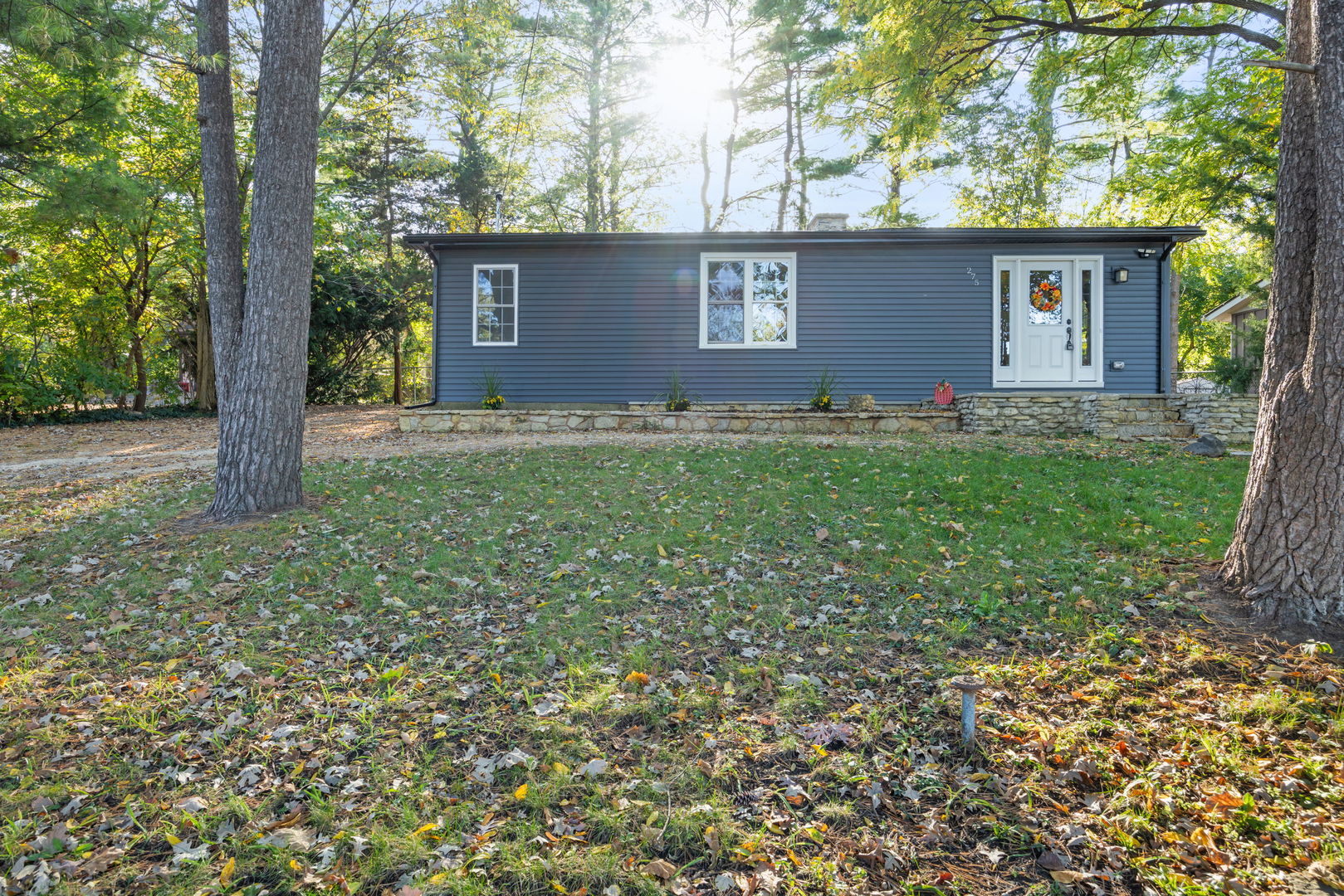 275 Indian Trail Lake In The Hills, IL 60156 - Photo 2 of 25 a front view of a house with garden