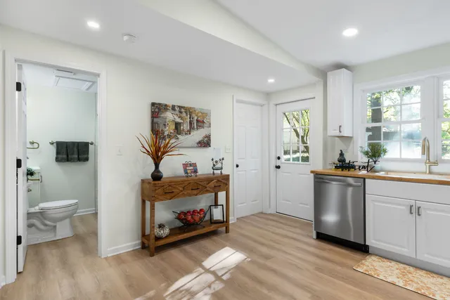 a room with a fireplace and wooden floor
