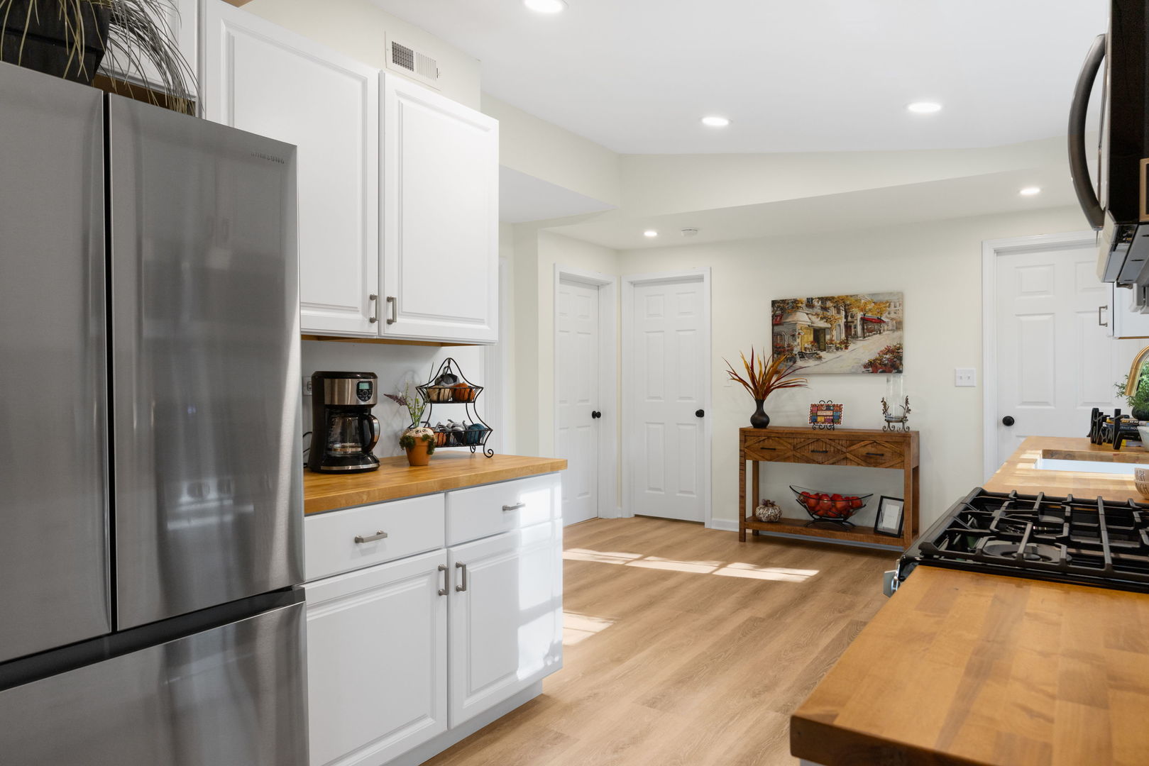 275 Indian Trail Lake In The Hills, IL 60156 - Photo 9 of 25 a kitchen with stainless steel appliances a refrigerator sink and cabinets