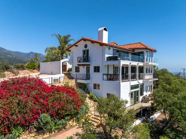 a front view of a residential apartment building with a yard