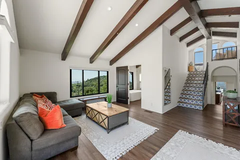 a white bath tub sitting in a bathroom next to a window