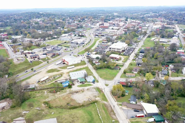 an aerial view of residential houses with outdoor space
