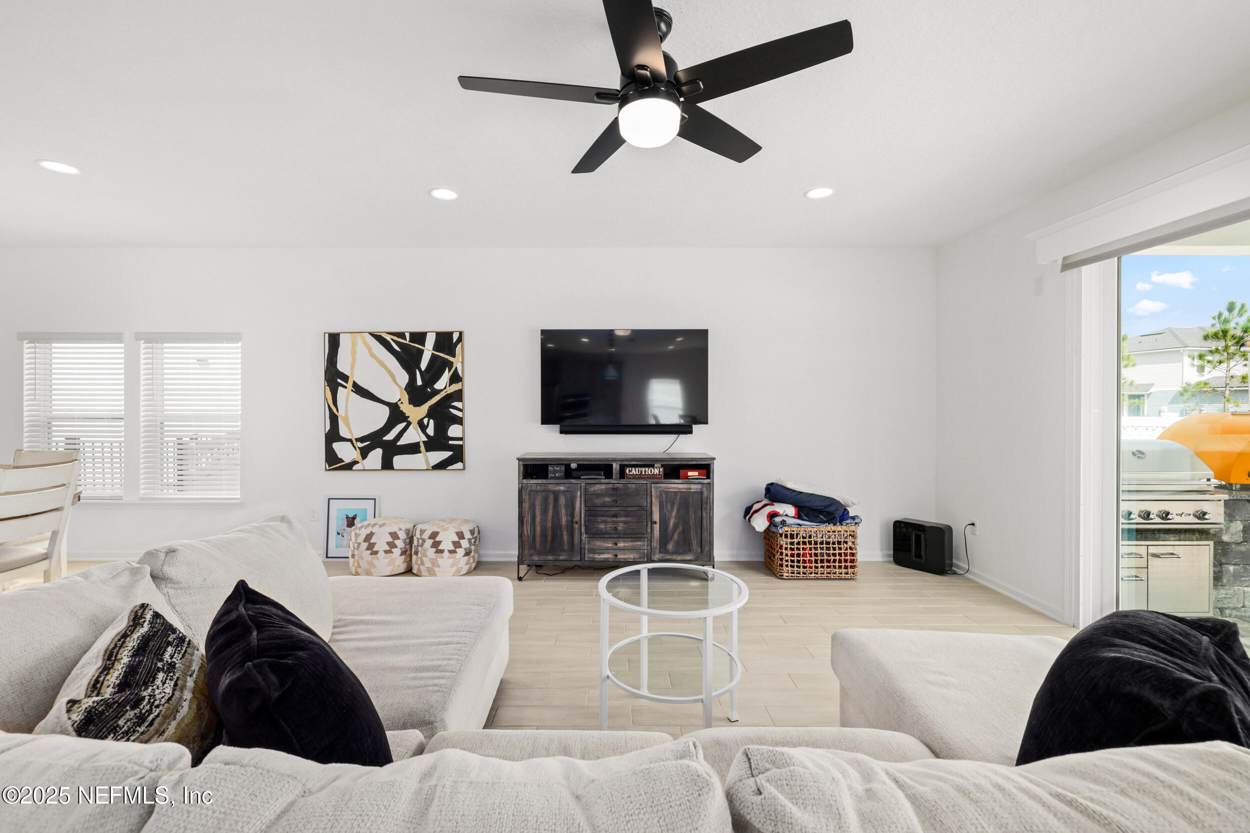 219 Goldcrest Way St. Augustine, FL 32092 - Photo 12 of 55 a living room with furniture and a flat screen tv
