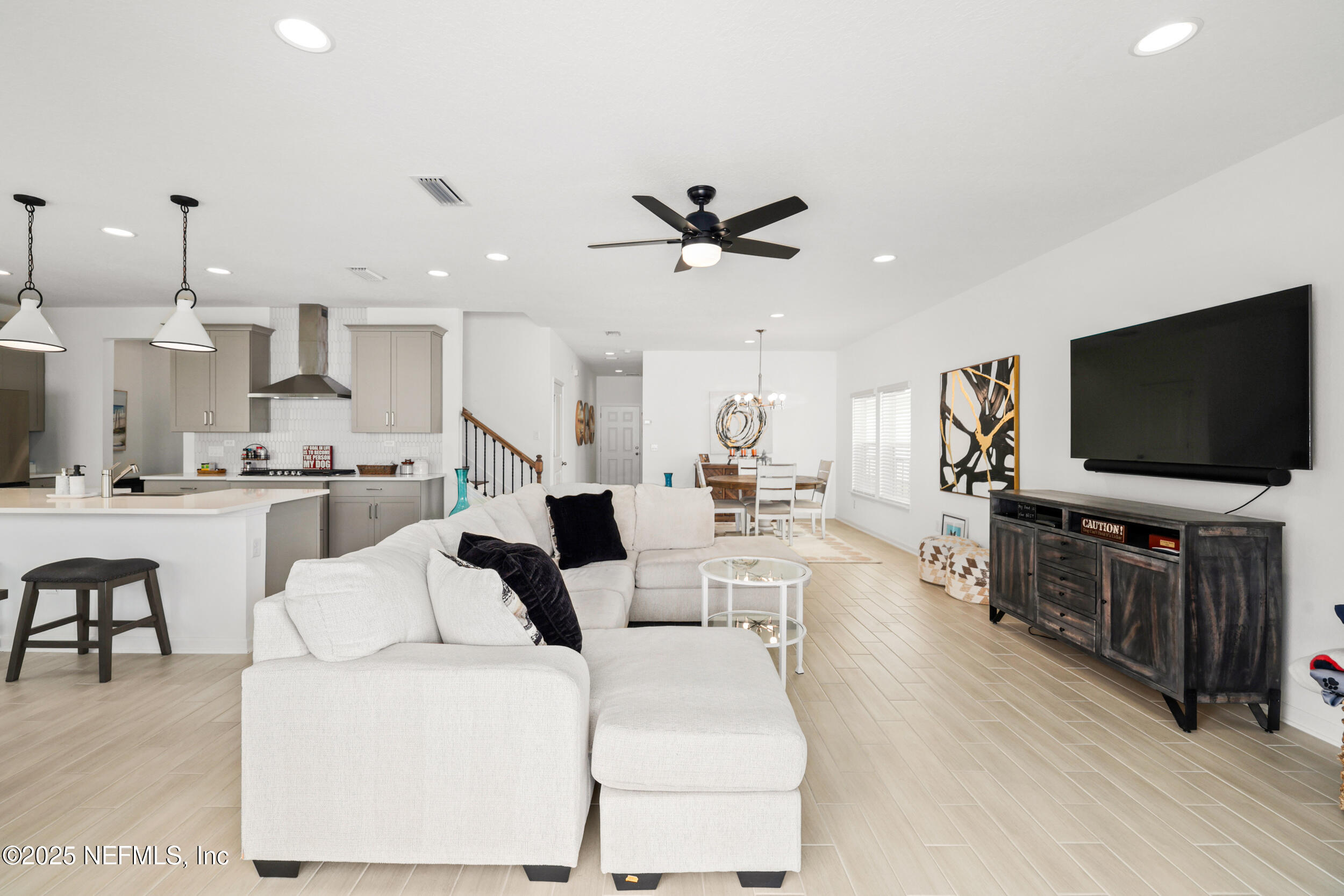 219 Goldcrest Way St. Augustine, FL 32092 - Photo 13 of 55 a living room with furniture and a flat screen tv