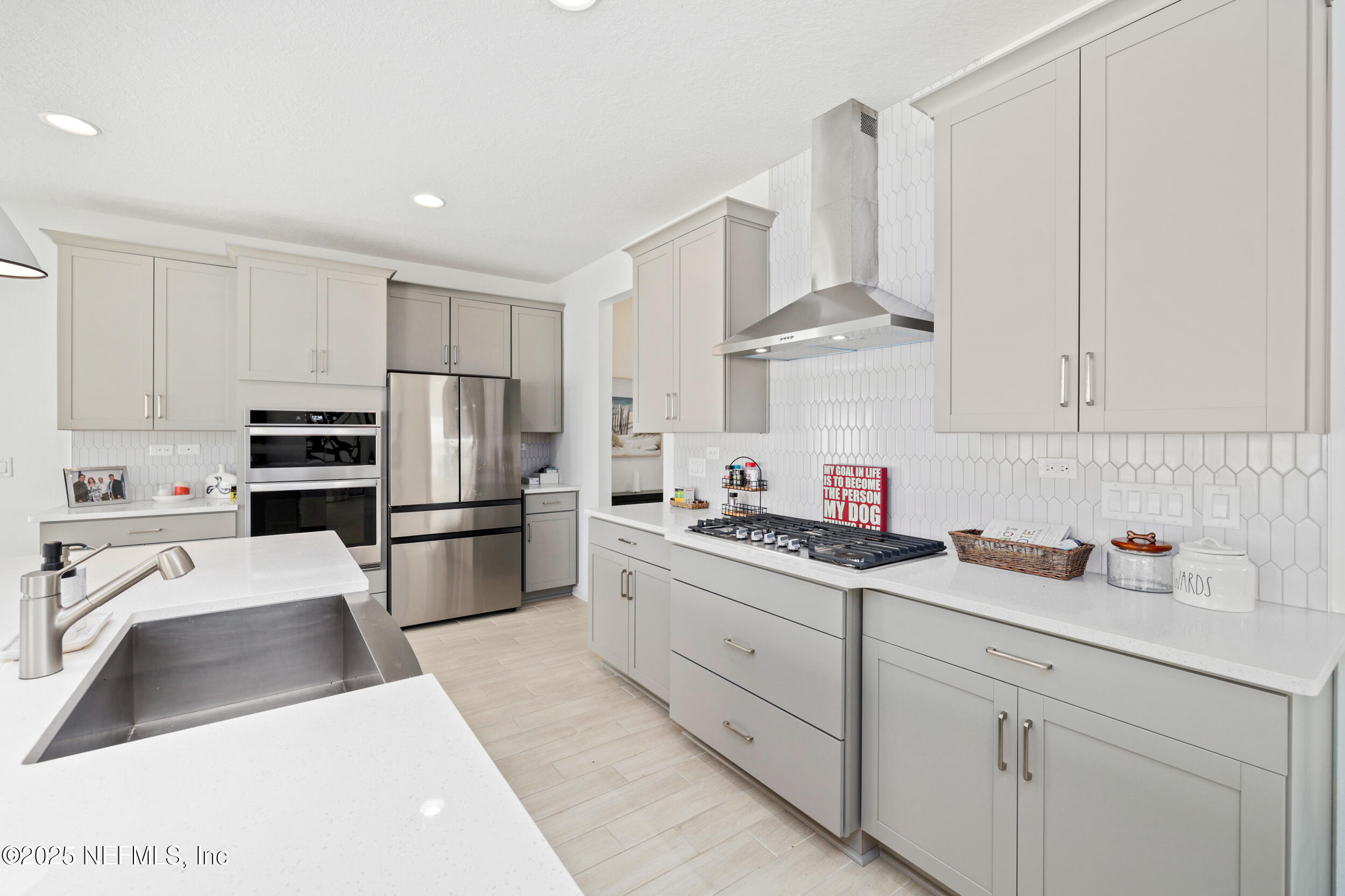 219 Goldcrest Way St. Augustine, FL 32092 - Photo 17 of 55 a kitchen with stainless steel appliances a refrigerator sink and cabinets