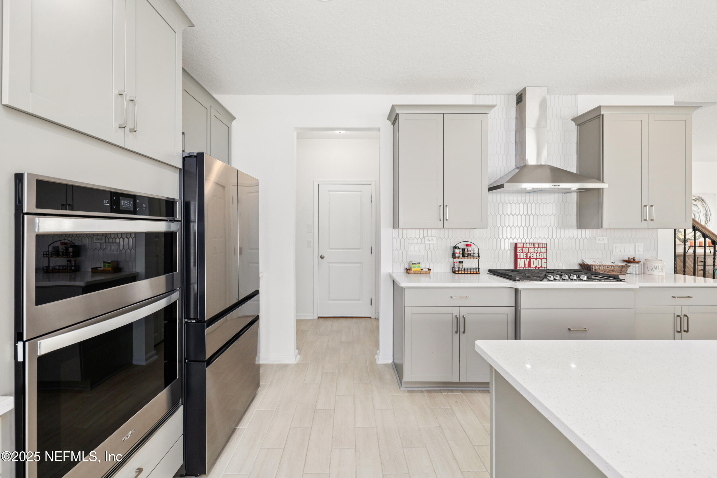 219 Goldcrest Way St. Augustine, FL 32092 - Photo 20 of 55 a kitchen with cabinets a stainless steel appliances and sink