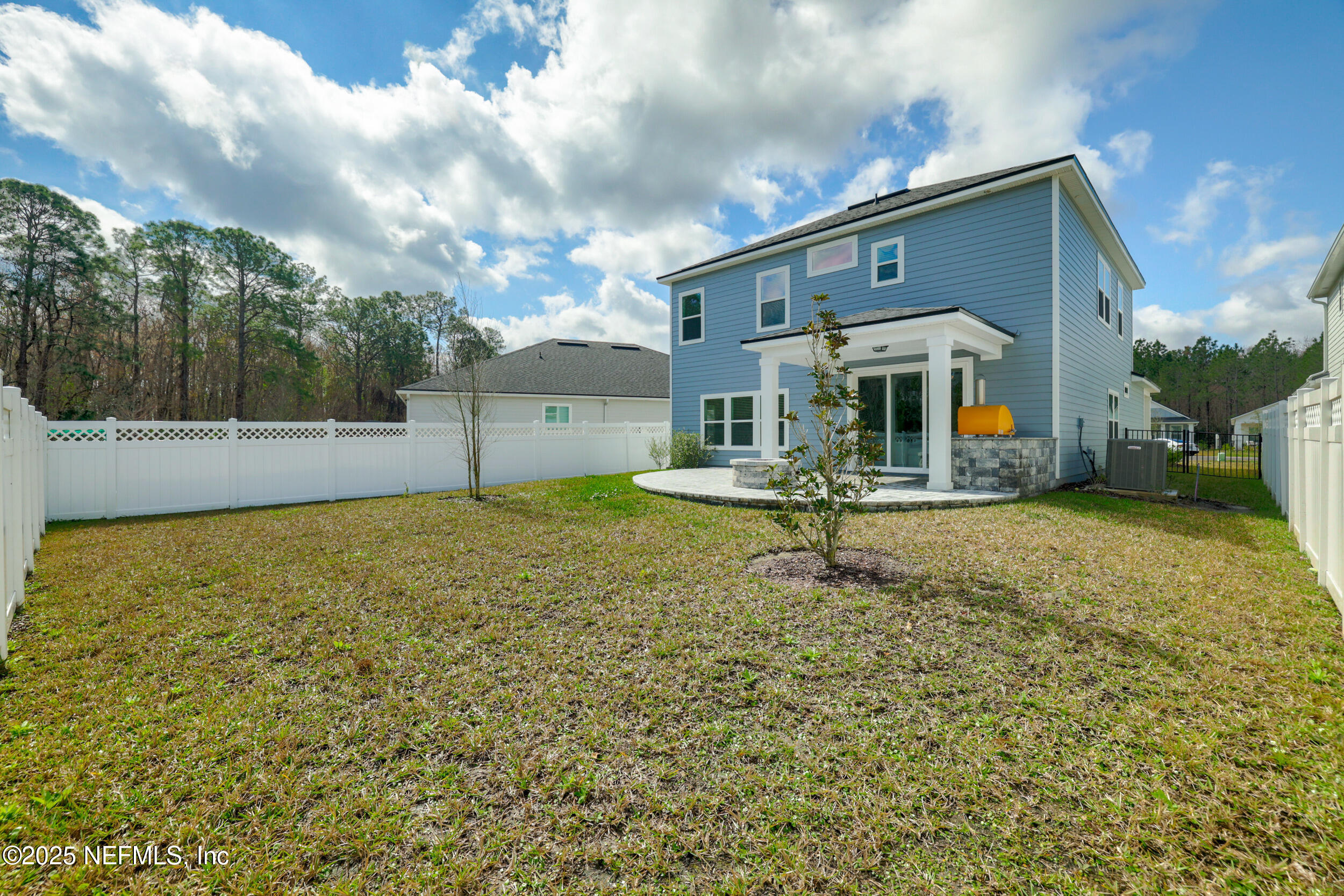 219 Goldcrest Way St. Augustine, FL 32092 - Photo 39 of 55 a white house with a yard and a fountain