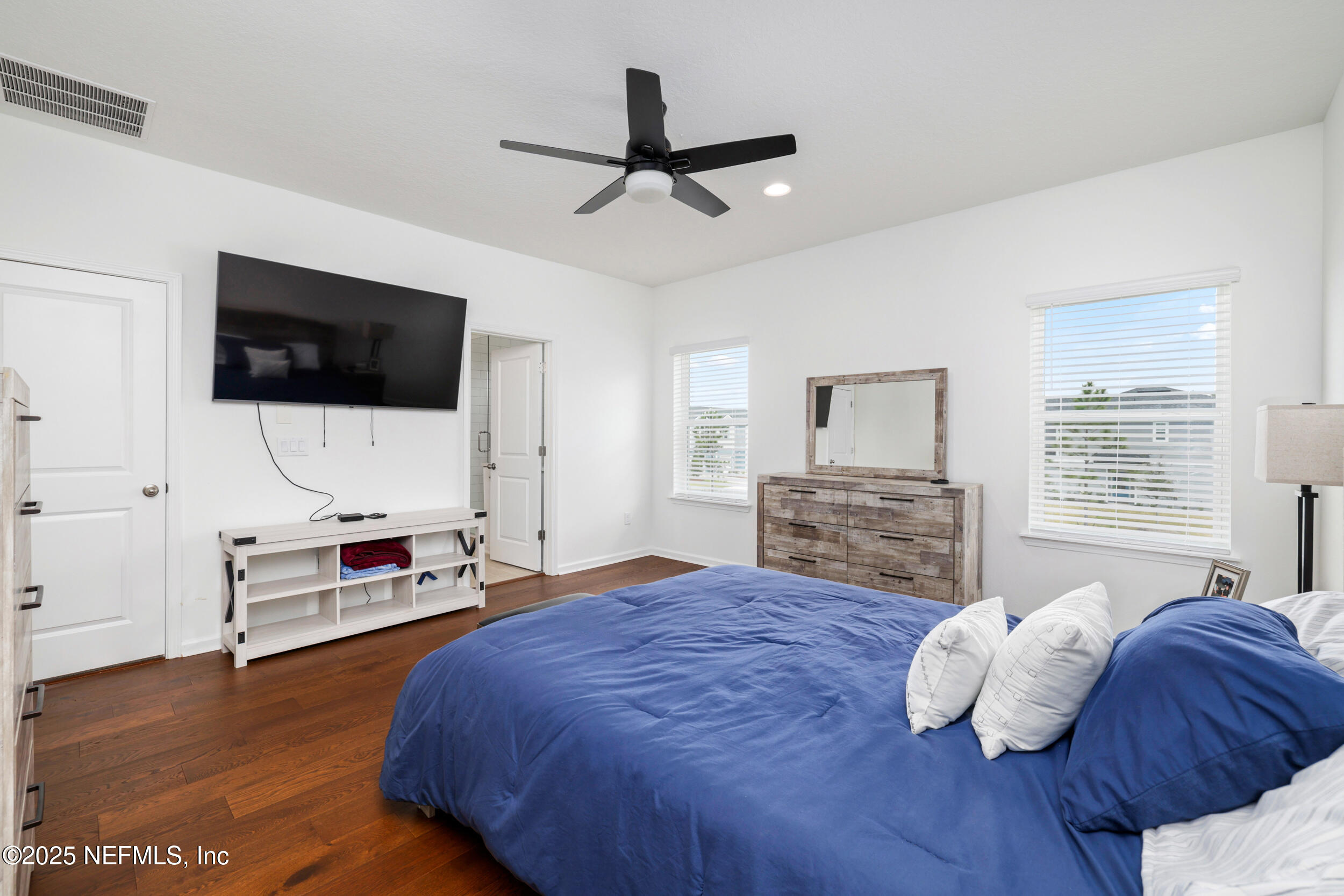 219 Goldcrest Way St. Augustine, FL 32092 - Photo 3 of 55 a bedroom with a bed furniture and a flat screen tv