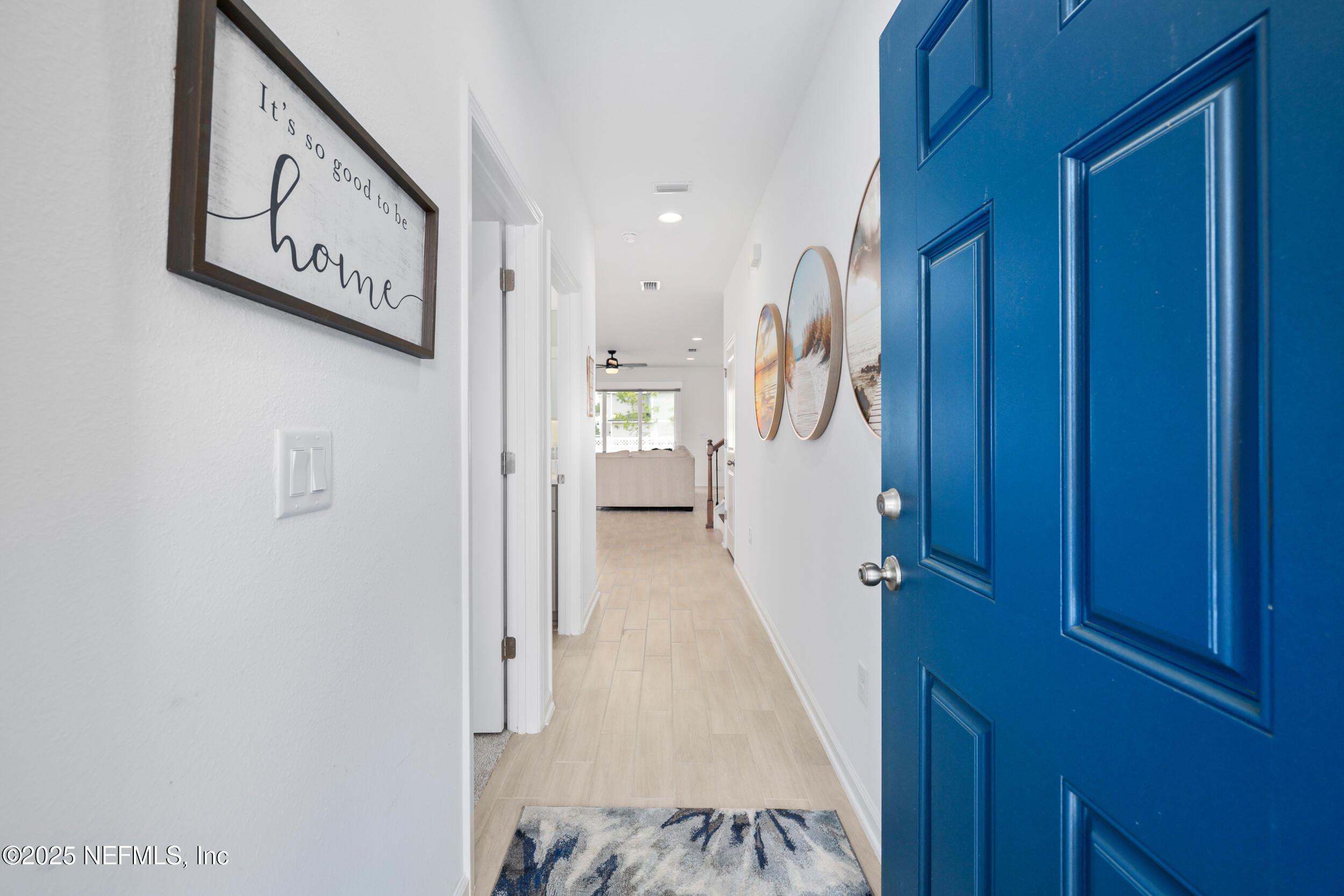 219 Goldcrest Way St. Augustine, FL 32092 - Photo 6 of 55 a view of a hallway with wooden floor and staircase