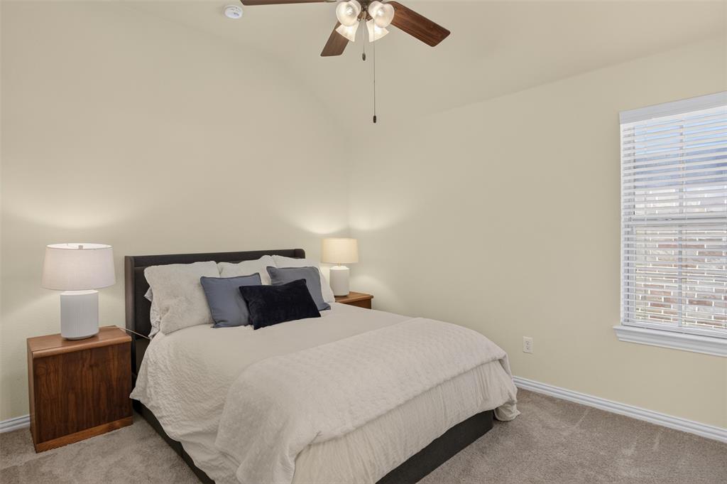 842 Sun Meadow Road Allen, TX 75013 - Photo 23 of 39 Vaulted ceiling bedroom with neutral wall tones and plush carpet flooring