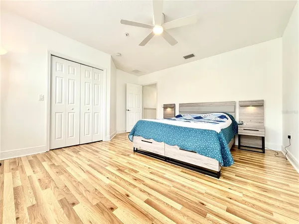 a bedroom with a bed and a dresser