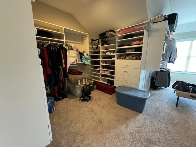 a view of a patio with chairs and table in patio