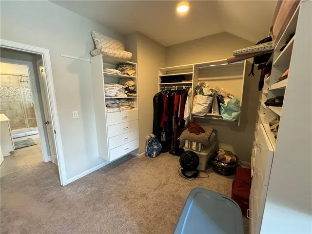 a view of backyard with a table and chairs