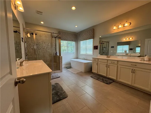 a view of a backyard with sitting area