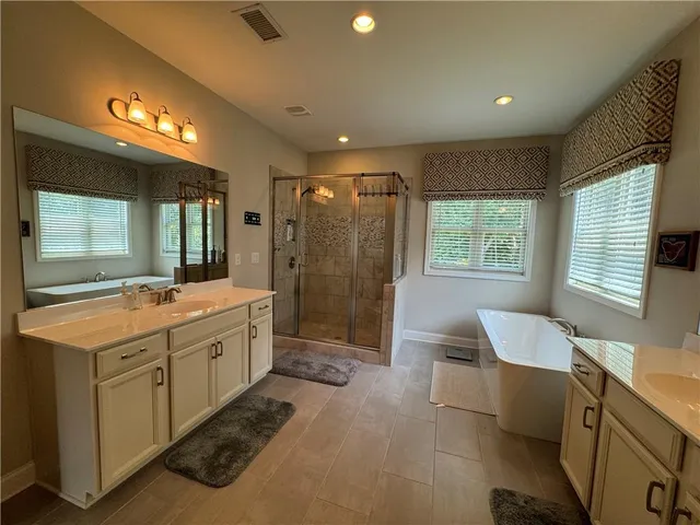 a view of a backyard with sitting area