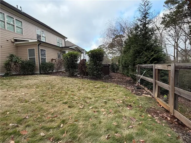 a living room with furniture and a lamp