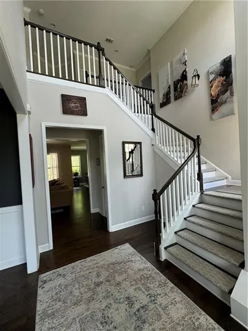 a spacious bathroom with a sink and a mirror