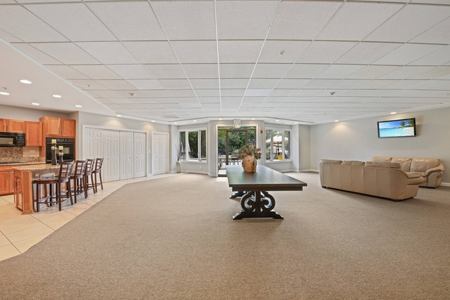 1 Renaissance Place, Unit 719 Palatine, IL 60067 - Photo 12 of 20 a living room with furniture and a table