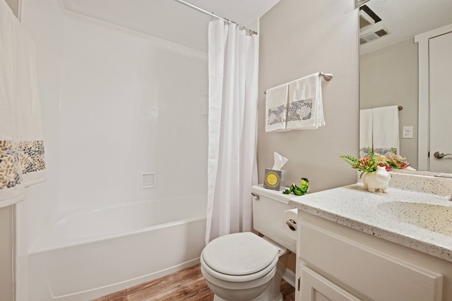 1 Renaissance Place, Unit 719 Palatine, IL 60067 - Photo 8 of 20 a bathroom with a granite countertop toilet sink and mirror