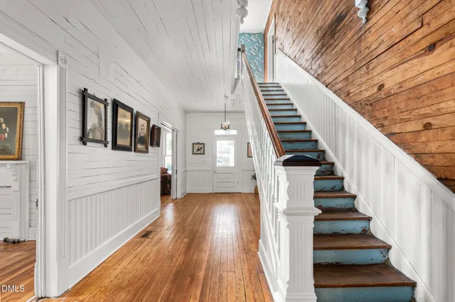 a view of entryway with wooden floor