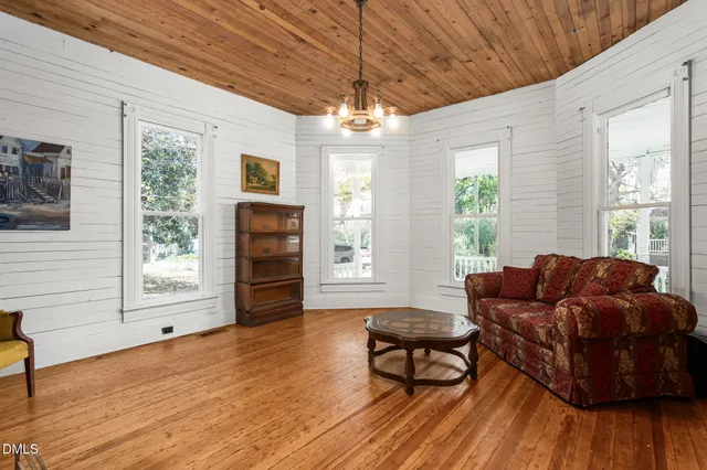 a view of hallway with wooden floor