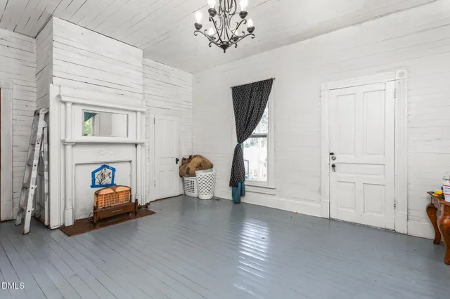 a bathroom with a shower curtain and a toilet
