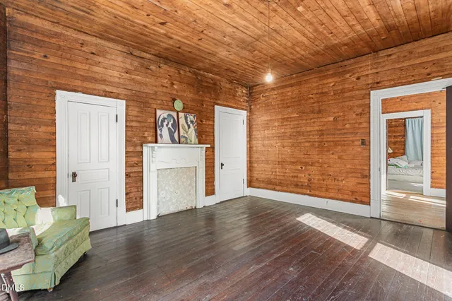 a view of a livingroom with furniture and a fireplace