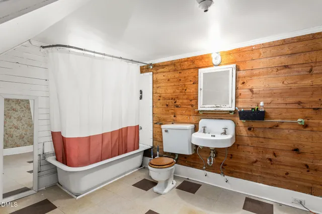 a view of livingroom with an empty space and wooden floor