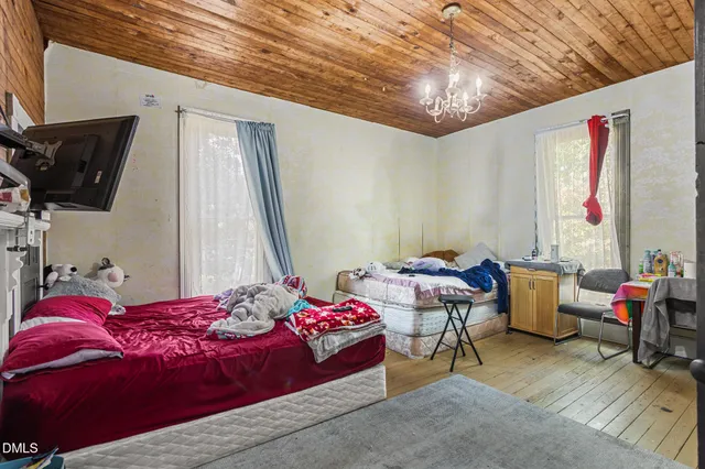 a view of a patio with a table and chairs and potted plants