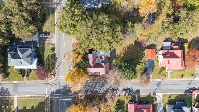 an aerial view of a house with yard