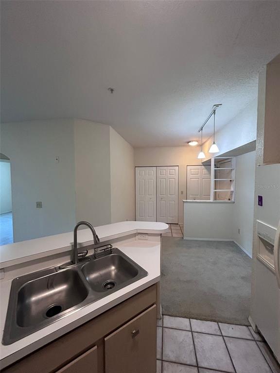 832 Camargo Way, Unit 303 Altamonte Springs, FL 32714 - Photo 12 of 27 a kitchen with a sink cabinets and appliances