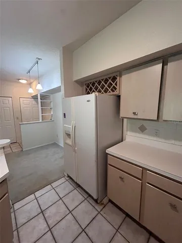a utility room with cabinets and washer dryer