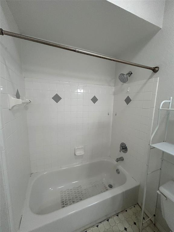 832 Camargo Way, Unit 303 Altamonte Springs, FL 32714 - Photo 22 of 27 a bathroom with a bathtub and a shower