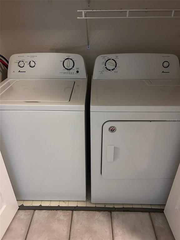 832 Camargo Way, Unit 303 Altamonte Springs, FL 32714 - Photo 24 of 27 a utility room with dryer and washer
