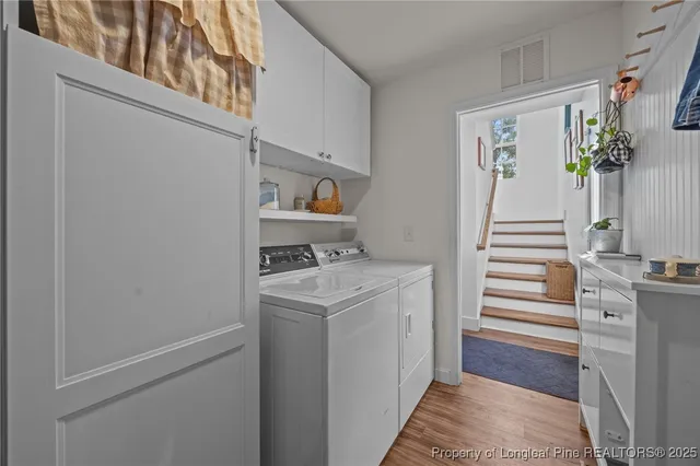 a view of hallway with washer and dryer