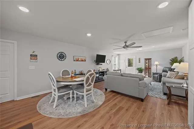 a living room with furniture a window and a table